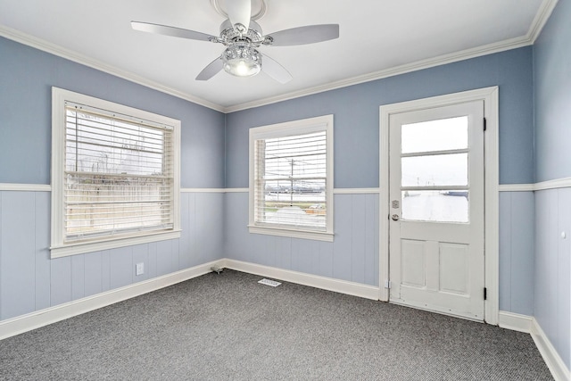 805 N Chancery St, Mcminnville, TN 37110 - foyer with dark carpet, crown molding, a wainscoted wall, and ceiling fan