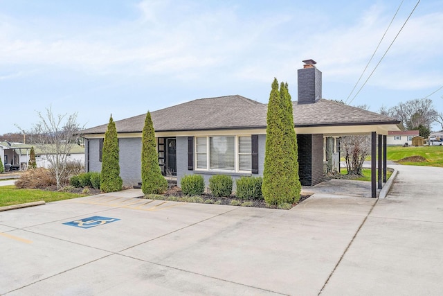 805 N Chancery St, Mcminnville, TN 37110 - ranch-style home with a chimney, brick siding, and roof with shingles