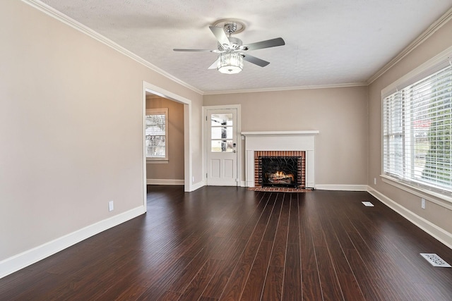 805 N Chancery St, Mcminnville, TN 37110 - unfurnished living room featuring ceiling fan, a brick fireplace, dark wood-type flooring, and crown molding