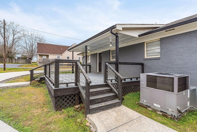 805 N Chancery St, Mcminnville, TN 37110 - property entrance with brick siding, a wooden deck, and a lawn