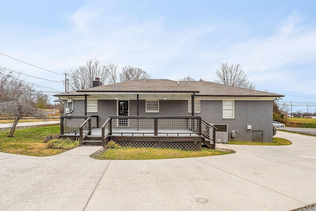 805 N Chancery St, Mcminnville, TN 37110 - view of front of home with a porch, a chimney, roof with shingles, and brick siding