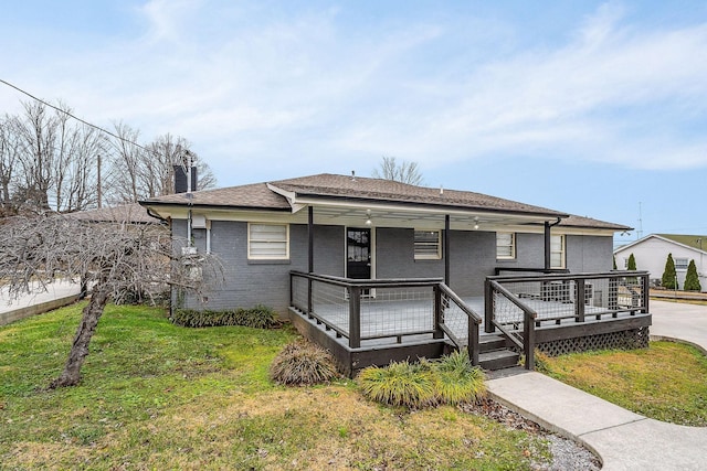 805 N Chancery St, Mcminnville, TN 37110 - view of front of property with a front lawn, a shingled roof, and brick siding