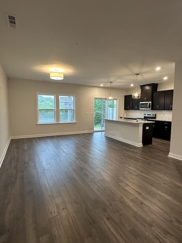 2127 Cheltenham Pl, Columbia, TN 38401 - unfurnished living room featuring dark wood finished floors, recessed lighting, and a chandelier