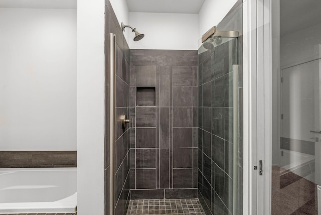 700 12th Ave S Unit 507, Nashville, TN 37203 - full bathroom with a shower stall and a garden tub