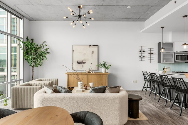 700 12th Ave S Unit 507, Nashville, TN 37203 - living area with wood finished floors and a chandelier
