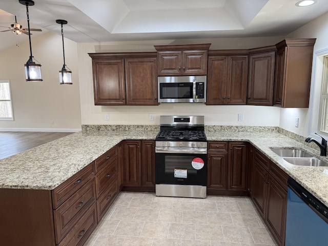 334 Cumberland Cove Rd Unit 5, Monterey, TN 38574 - kitchen with stainless steel appliances, a tray ceiling, ceiling fan, a peninsula, and light stone countertops
