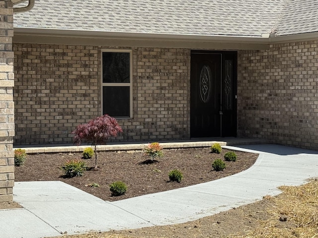 334 Cumberland Cove Rd Unit 5, Monterey, TN 38574 - view of exterior entry featuring roof with shingles and brick siding
