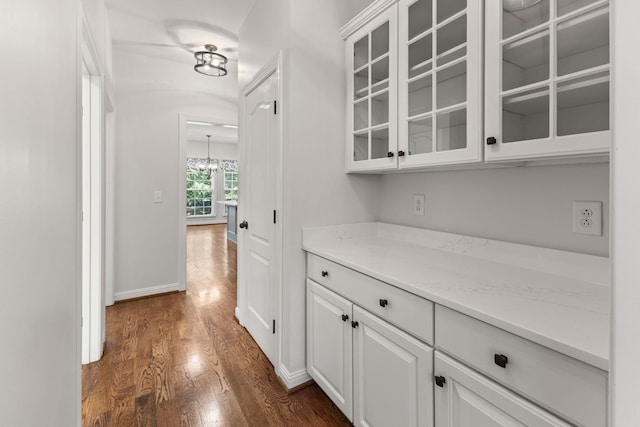 630 Black Horse Pkwy, Franklin, TN 37069 - bar area featuring dark wood finished floors and a chandelier