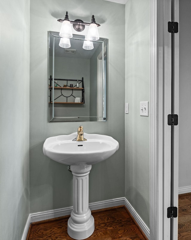 630 Black Horse Pkwy, Franklin, TN 37069 - bathroom featuring baseboards and wood finished floors