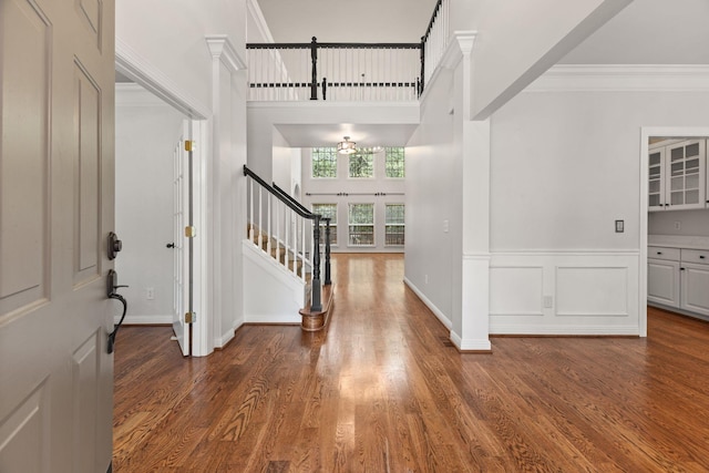 630 Black Horse Pkwy, Franklin, TN 37069 - foyer entrance featuring stairway, wood finished floors, ornamental molding, and a high ceiling