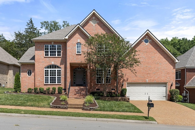 630 Black Horse Pkwy, Franklin, TN 37069 - view of front facade featuring brick siding, concrete driveway, a front yard, and a garage