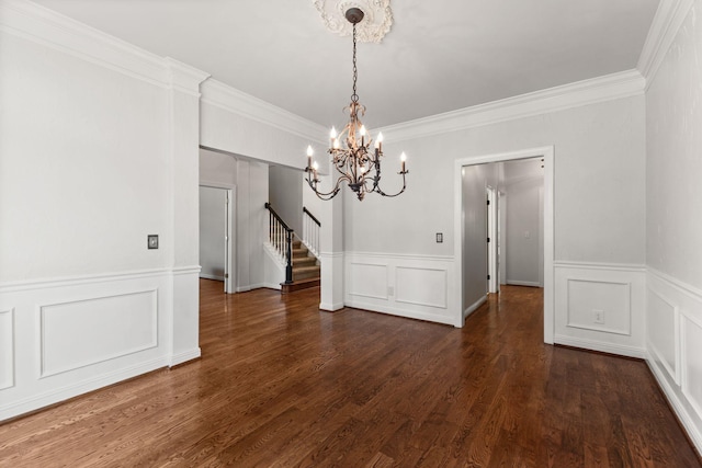 630 Black Horse Pkwy, Franklin, TN 37069 - unfurnished dining area featuring a chandelier, stairway, a decorative wall, crown molding, and a wainscoted wall
