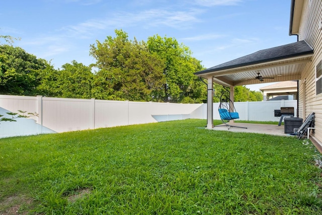 3116 Mapleside Ln, Murfreesboro, TN 37128 - fenced backyard with a ceiling fan and a patio area