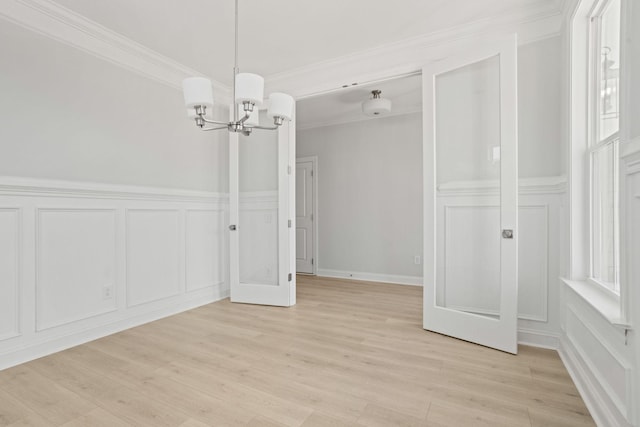 7507 Old Nashville Rd S, Fairview, TN 37062 - unfurnished dining area with a decorative wall, a chandelier, light wood finished floors, and crown molding