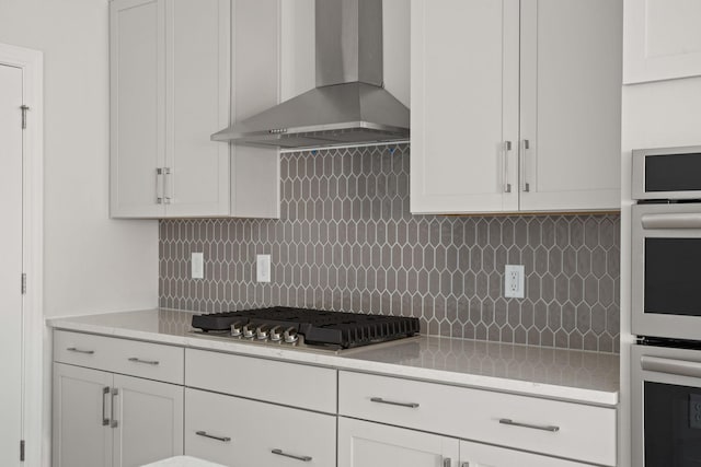 7507 Old Nashville Rd S, Fairview, TN 37062 - kitchen featuring wall chimney exhaust hood, stainless steel appliances, light countertops, and tasteful backsplash