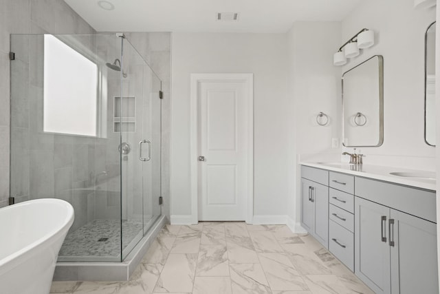 7507 Old Nashville Rd S, Fairview, TN 37062 - bathroom with marble look tiles, double vanity, a soaking tub, and a shower stall