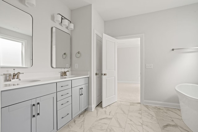 7507 Old Nashville Rd S, Fairview, TN 37062 - full bathroom with marble finish flooring, double vanity, and a freestanding tub
