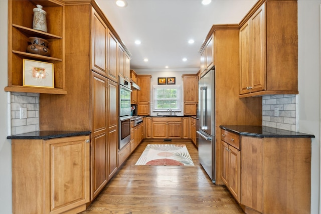 1470 Tyne Blvd, Nashville, TN 37215 - kitchen with open shelves, light wood-style floors, appliances with stainless steel finishes, crown molding, and backsplash
