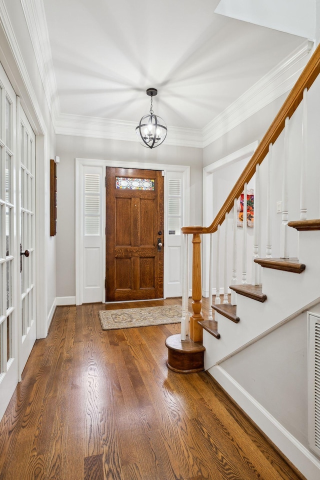 1470 Tyne Blvd, Nashville, TN 37215 - foyer entrance featuring a chandelier, wood finished floors, stairs, and ornamental molding