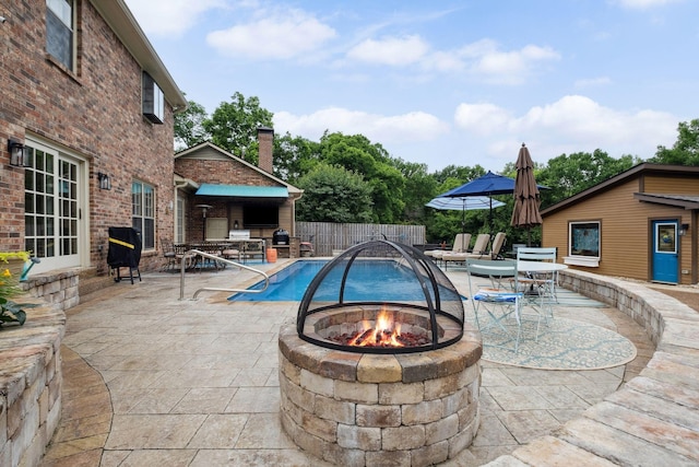 1470 Tyne Blvd, Nashville, TN 37215 - view of pool featuring an outdoor fire pit, a patio area, a grill, and an outbuilding