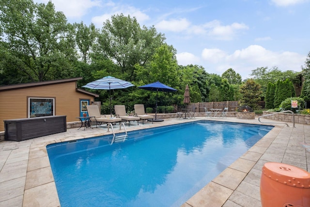 1470 Tyne Blvd, Nashville, TN 37215 - view of swimming pool with a patio area, an outdoor fire pit, and an outdoor structure