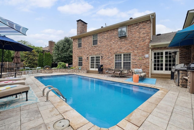 1470 Tyne Blvd, Nashville, TN 37215 - view of swimming pool with a patio area, outdoor dining space, and exterior kitchen