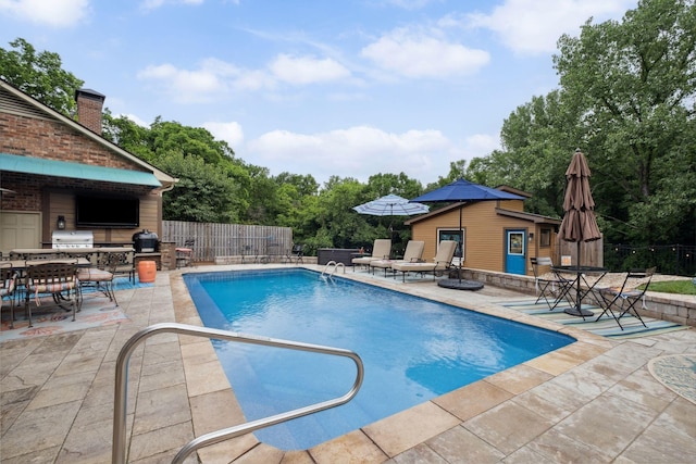 1470 Tyne Blvd, Nashville, TN 37215 - view of pool with an outdoor kitchen, a patio, an outdoor structure, a storage structure, and outdoor dining area