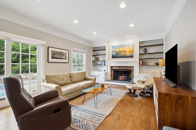 1470 Tyne Blvd, Nashville, TN 37215 - living room featuring ornamental molding, light wood finished floors, a brick fireplace, recessed lighting, and built in shelves