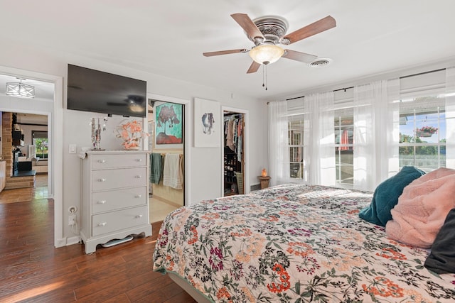 605 Jackson Ave, Carthage, TN 37030 - bedroom with dark wood-style floors, a spacious closet, a closet, a ceiling fan, and ensuite bathroom