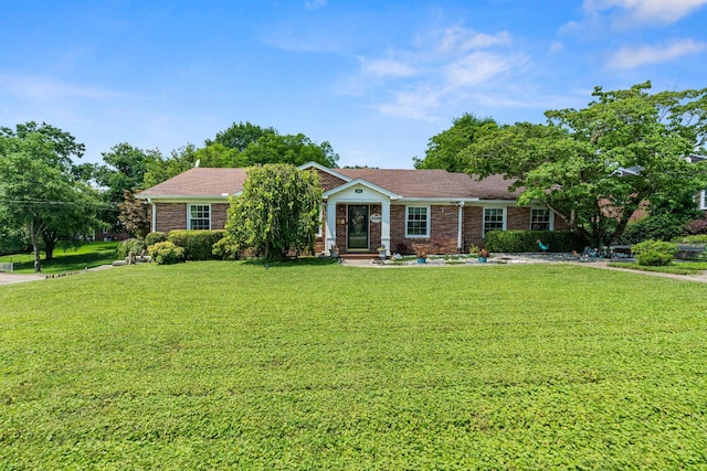 605 Jackson Ave, Carthage, TN 37030 - ranch-style home featuring a front lawn and brick siding