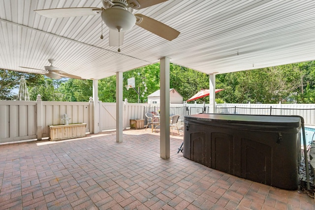 605 Jackson Ave, Carthage, TN 37030 - fenced backyard featuring a ceiling fan, a hot tub, and a patio area
