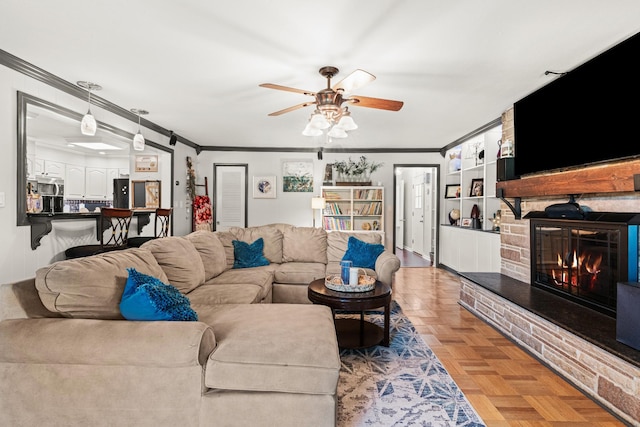 605 Jackson Ave, Carthage, TN 37030 - living area with crown molding, ceiling fan, and a fireplace