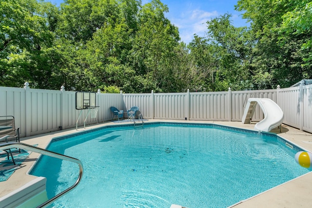 605 Jackson Ave, Carthage, TN 37030 - view of pool featuring a water slide, a fenced backyard, and view of wooded area