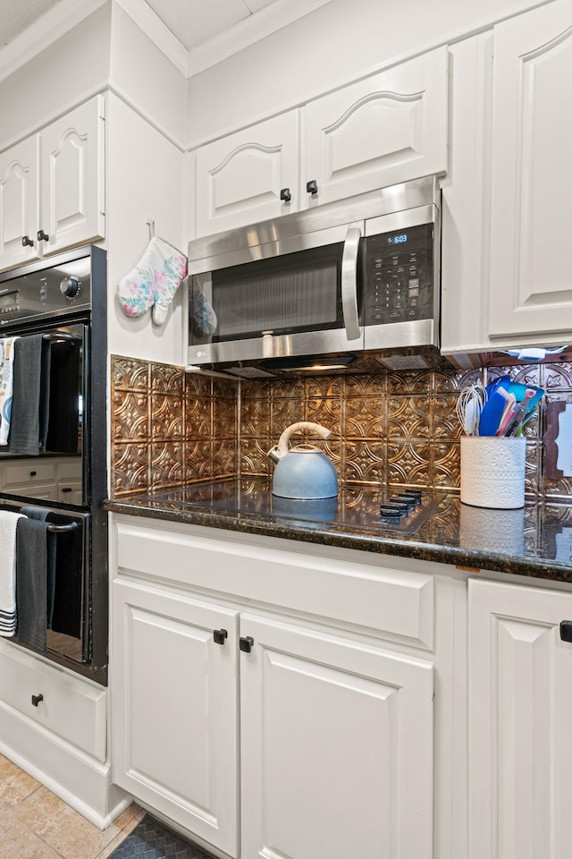 605 Jackson Ave, Carthage, TN 37030 - kitchen with black appliances, tasteful backsplash, white cabinetry, crown molding, and dark stone countertops