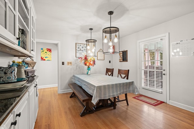 605 Jackson Ave, Carthage, TN 37030 - dining room featuring light wood-type flooring and baseboards