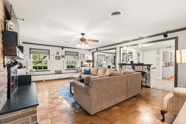 605 Jackson Ave, Carthage, TN 37030 - living area featuring ornamental molding, a ceiling fan, and a fireplace