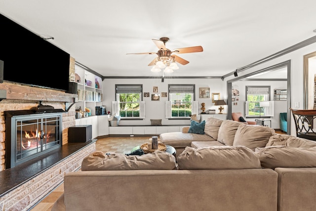 605 Jackson Ave, Carthage, TN 37030 - living area with crown molding, ceiling fan, a fireplace, and wood finished floors