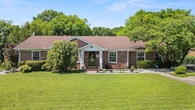 605 Jackson Ave, Carthage, TN 37030 - view of front of house featuring a front lawn and brick siding