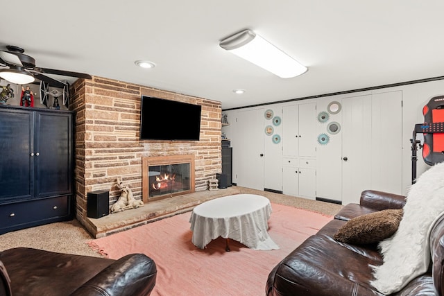 605 Jackson Ave, Carthage, TN 37030 - living area featuring a ceiling fan, a stone fireplace, and carpet floors