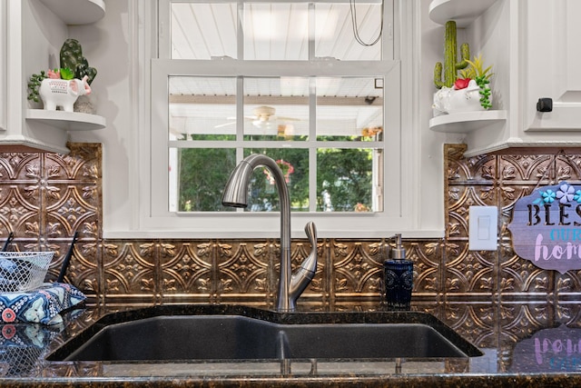 605 Jackson Ave, Carthage, TN 37030 - kitchen view of backsplash, white cabinetry, and dark stone countertops