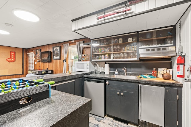 605 Jackson Ave, Carthage, TN 37030 - indoor wet bar with dishwasher, white microwave, fridge, and wood walls