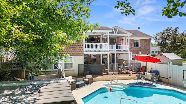 605 Jackson Ave, Carthage, TN 37030 - rear view of house with a balcony, brick siding, and a patio area