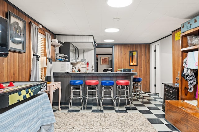 605 Jackson Ave, Carthage, TN 37030 - bar with dark floors, white microwave, and wood walls