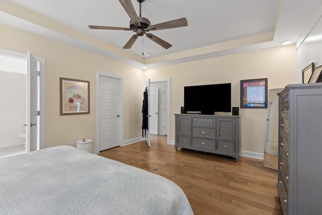 1588 Cobbler Ct, Chattanooga, TN 37421 - bedroom with a raised ceiling, wood finished floors, a ceiling fan, and connected bathroom
