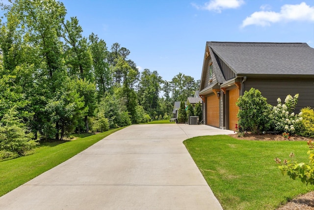 1588 Cobbler Ct, Chattanooga, TN 37421 - view of property exterior with driveway, a lawn, and a shingled roof