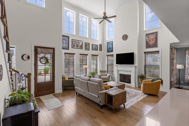 1588 Cobbler Ct, Chattanooga, TN 37421 - living area with a towering ceiling, hardwood / wood-style flooring, a ceiling fan, a fireplace, and stairway