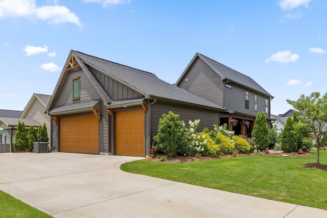 1588 Cobbler Ct, Chattanooga, TN 37421 - view of front of property with driveway, a front lawn, board and batten siding, a garage, and a shingled roof