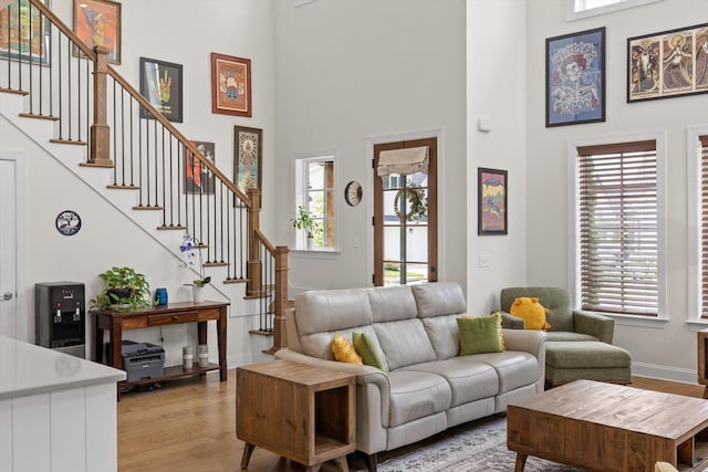 1588 Cobbler Ct, Chattanooga, TN 37421 - living area with light wood-style flooring, healthy amount of natural light, stairs, and a high ceiling
