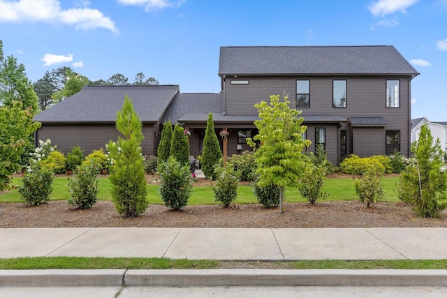 1588 Cobbler Ct, Chattanooga, TN 37421 - view of front facade featuring a front lawn and roof with shingles