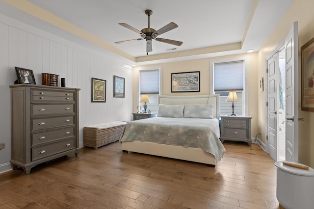 1588 Cobbler Ct, Chattanooga, TN 37421 - bedroom with wood-type flooring, a raised ceiling, and ceiling fan
